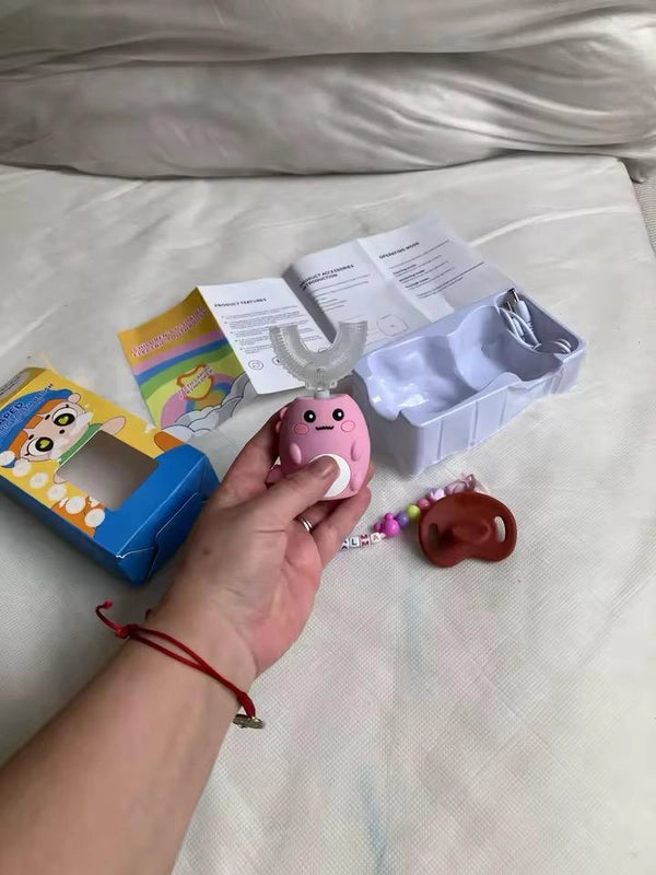 Cepillo de dientes eléctrico infantil Rexi en forma de U con carcasa de dinosaurio